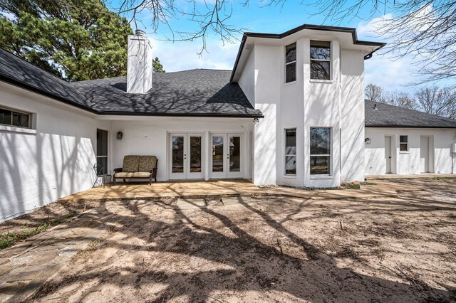 5327 Dusty Rd, Athens, TX 75752 - back of property featuring french doors, stucco siding, a chimney, a shingled roof, and a patio area