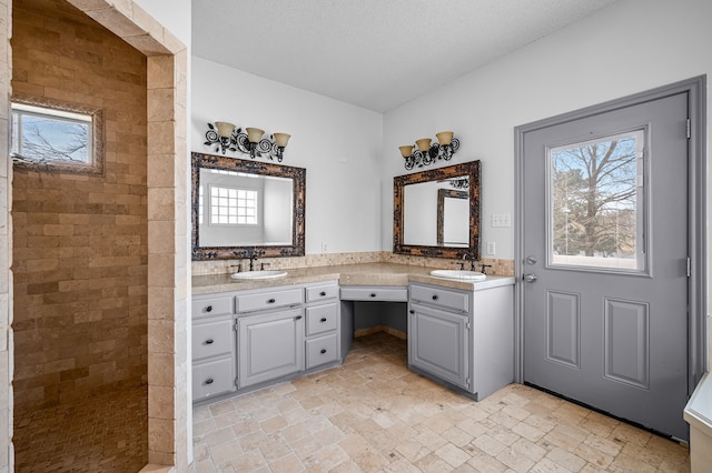 5327 Dusty Rd, Athens, TX 75752 - bathroom with plenty of natural light, double vanity, and stone tile flooring