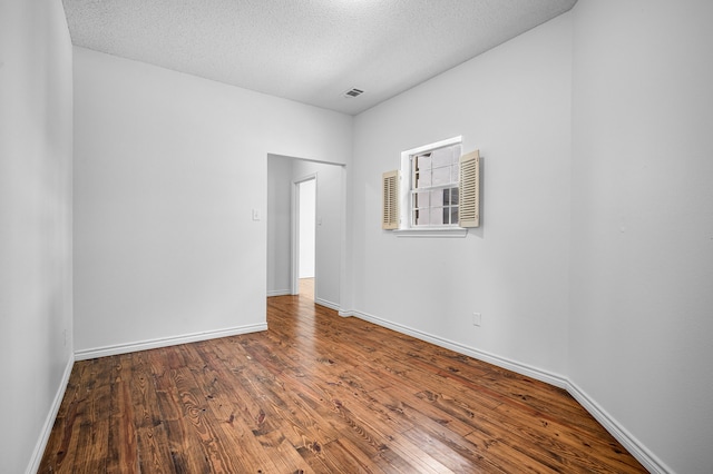 5327 Dusty Rd, Athens, TX 75752 - spare room with wood finished floors, baseboards, and a textured ceiling