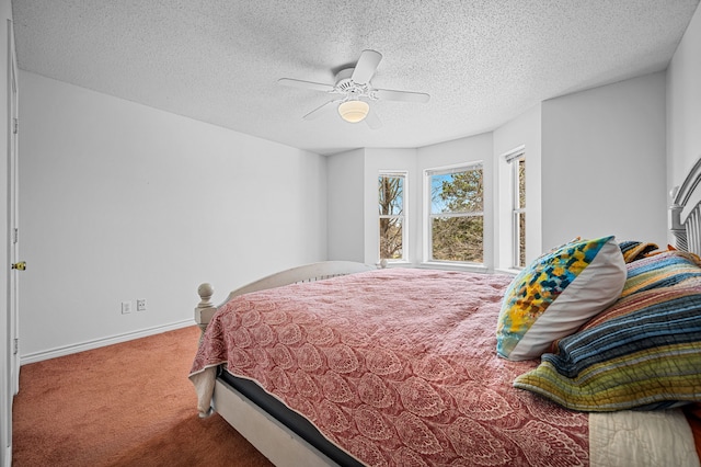5327 Dusty Rd, Athens, TX 75752 - carpeted bedroom featuring baseboards, ceiling fan, and a textured ceiling