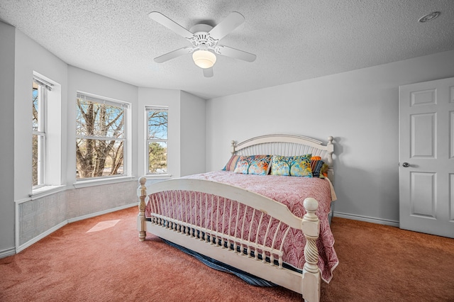 5327 Dusty Rd, Athens, TX 75752 - bedroom featuring carpet floors, multiple windows, a textured ceiling, baseboards, and a ceiling fan