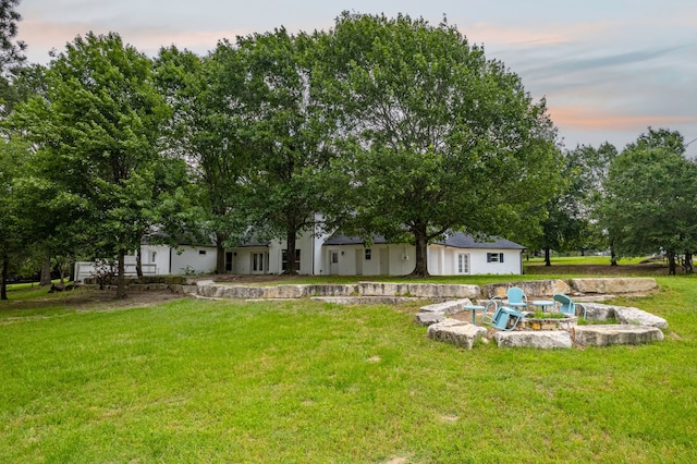 5327 Dusty Rd, Athens, TX 75752 - yard at dusk with a yard and a fire pit