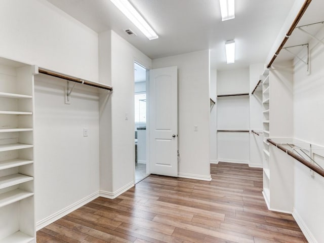 walk in closet with visible vents and light wood-style flooring