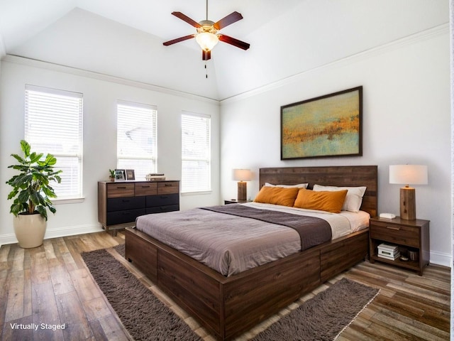 bedroom with hardwood / wood-style flooring, lofted ceiling, and baseboards