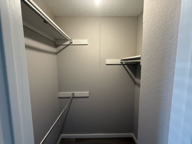 2240 Aspen Dr, Dallas, TX 75227 - walk in closet with wood finished floors