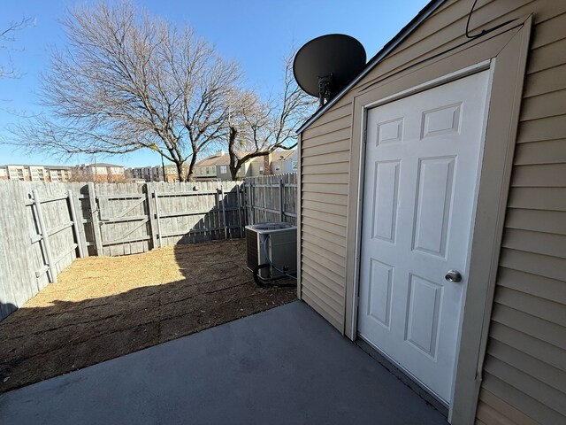 2240 Aspen Dr, Dallas, TX 75227 - view of patio / terrace with a gate, central AC, and fence