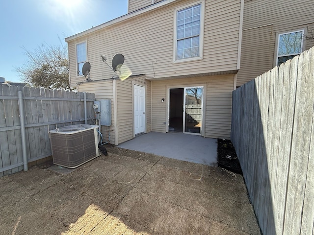 2240 Aspen Dr, Dallas, TX 75227 - back of property featuring cooling unit, a chimney, a patio, and fence