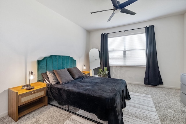 bedroom with baseboards, light colored carpet, and ceiling fan