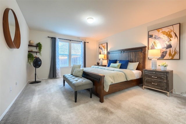 carpeted bedroom with visible vents and baseboards