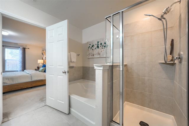 full bath with a bath, tile patterned flooring, a shower stall, and ensuite bathroom