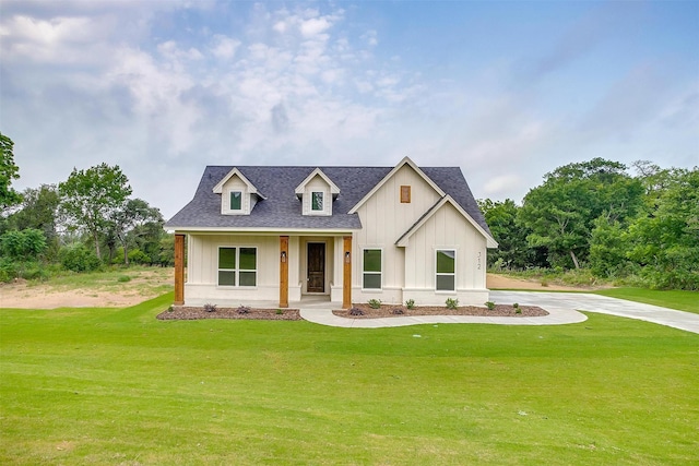 312 Falcon Ct, Springtown, TX 76082 - modern inspired farmhouse with a front lawn, roof with shingles, board and batten siding, and covered porch