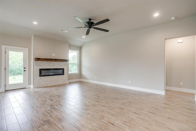 312 Falcon Ct, Springtown, TX 76082 - unfurnished living room with ceiling fan, a premium fireplace, recessed lighting, light wood finished floors, and baseboards