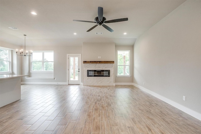 312 Falcon Ct, Springtown, TX 76082 - unfurnished living room featuring a chandelier, light wood-type flooring, baseboards, a ceiling fan, and recessed lighting
