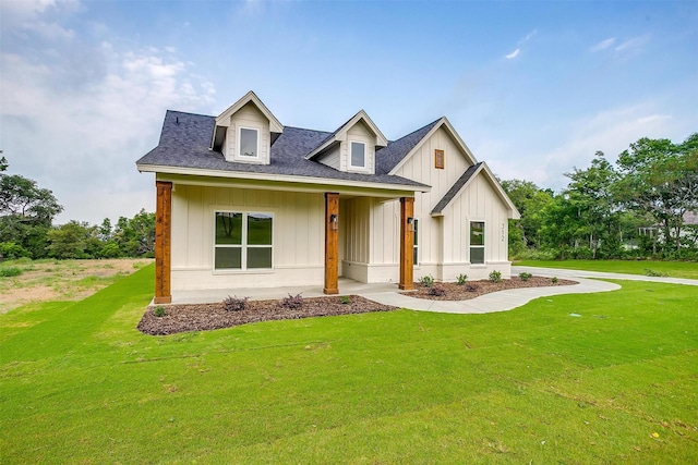 312 Falcon Ct, Springtown, TX 76082 - modern farmhouse style home featuring board and batten siding, a front yard, and roof with shingles