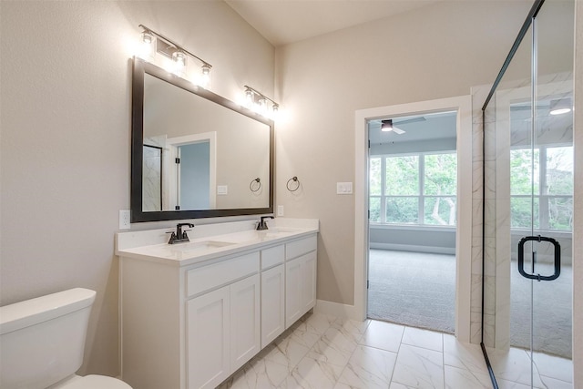 312 Falcon Ct, Springtown, TX 76082 - bathroom with marble look tile flooring, a shower stall, toilet, double vanity, and a ceiling fan