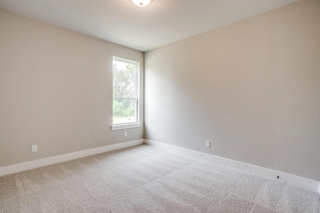 312 Falcon Ct, Springtown, TX 76082 - spare room featuring light colored carpet and baseboards