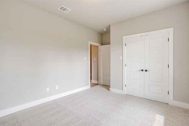 312 Falcon Ct, Springtown, TX 76082 - unfurnished bedroom featuring light carpet, a closet, and baseboards