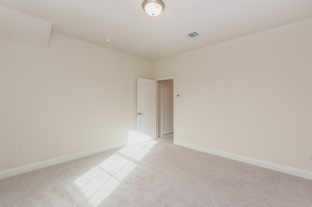 2112 Nassau Dr, Mckinney, TX 75071 - spare room featuring light carpet, visible vents, and baseboards
