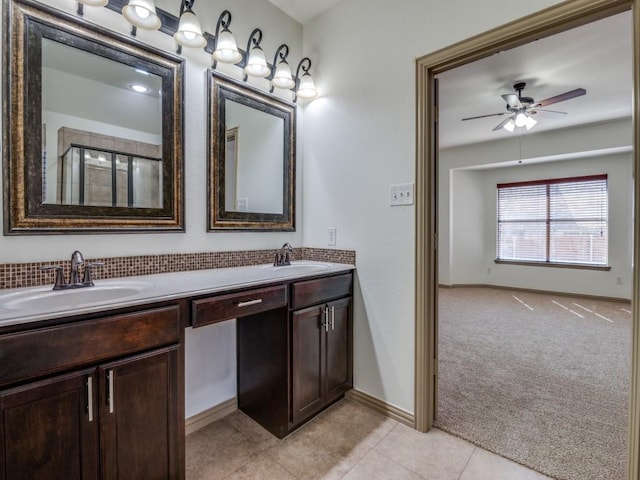 4406 Winding Glen Ln, Mansfield, TX 76063 - bathroom with double vanity, ceiling fan, tile patterned floors, and baseboards