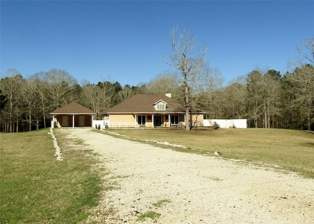 1430 State Highway 87 S, Hemphill, TX 75948 - view of front of home featuring fence, a front yard, a chimney, a garage, and driveway