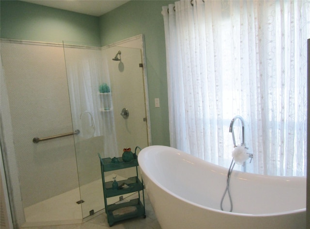 1430 State Highway 87 S, Hemphill, TX 75948 - bathroom featuring a shower stall and a freestanding tub
