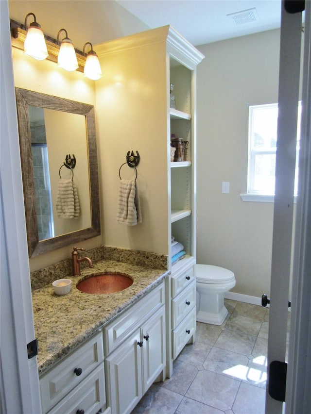 1430 State Highway 87 S, Hemphill, TX 75948 - bathroom featuring visible vents, toilet, tile patterned flooring, baseboards, and vanity