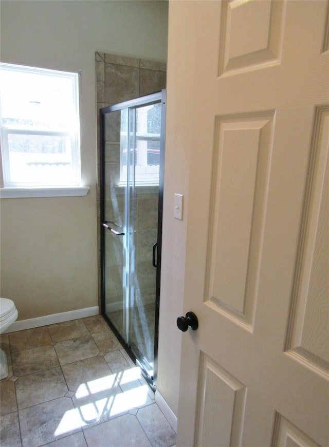 1430 State Highway 87 S, Hemphill, TX 75948 - bathroom with baseboards, toilet, and a shower stall