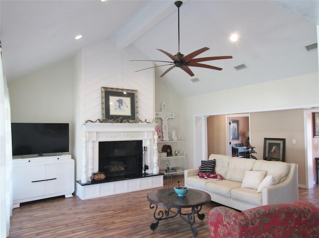 1430 State Highway 87 S, Hemphill, TX 75948 - living area featuring visible vents, a fireplace with raised hearth, a ceiling fan, wood finished floors, and vaulted ceiling with beams