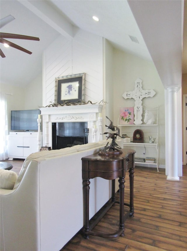1430 State Highway 87 S, Hemphill, TX 75948 - living area with beamed ceiling, high vaulted ceiling, a ceiling fan, wood finished floors, and a fireplace