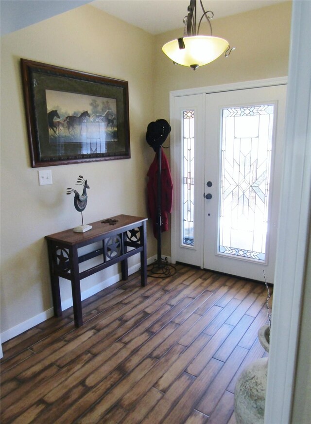 1430 State Highway 87 S, Hemphill, TX 75948 - foyer featuring baseboards and dark wood-style flooring