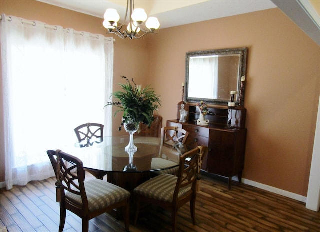 1430 State Highway 87 S, Hemphill, TX 75948 - dining room with baseboards, an inviting chandelier, and wood finished floors