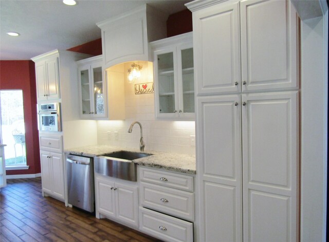 1430 State Highway 87 S, Hemphill, TX 75948 - kitchen featuring decorative backsplash, recessed lighting, white cabinets, stainless steel appliances, and a sink