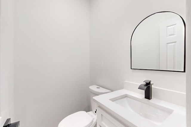half bath with toilet and vanity