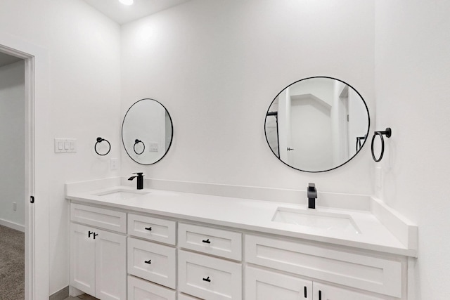 full bath featuring a sink and double vanity