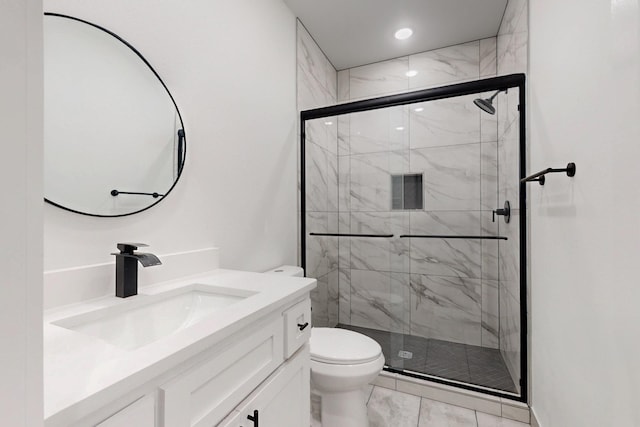 bathroom with a stall shower, vanity, marble finish floor, toilet, and recessed lighting