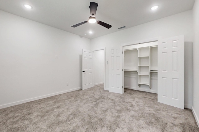 unfurnished bedroom featuring baseboards, visible vents, carpet floors, and recessed lighting