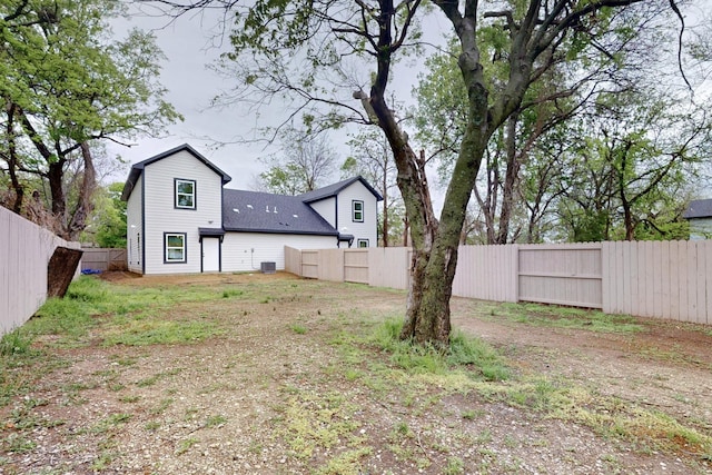 view of yard featuring a fenced backyard and central AC unit