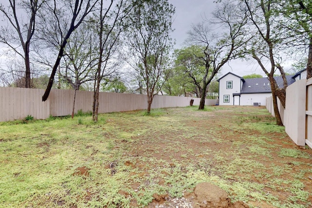 view of yard with a fenced backyard