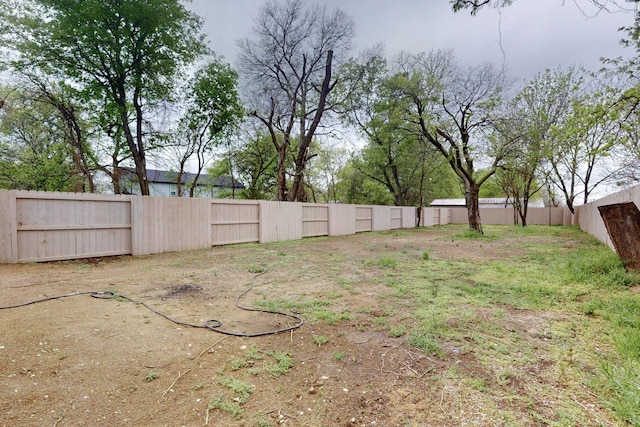 view of yard with a fenced backyard