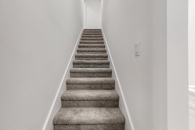staircase with baseboards