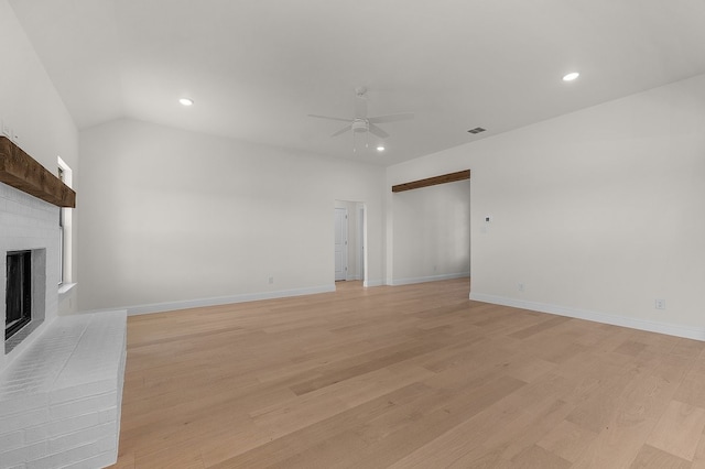 405 Red Roan Rdg, Brock, TX 76087 - unfurnished living room with a brick fireplace, light wood-style flooring, visible vents, and ceiling fan