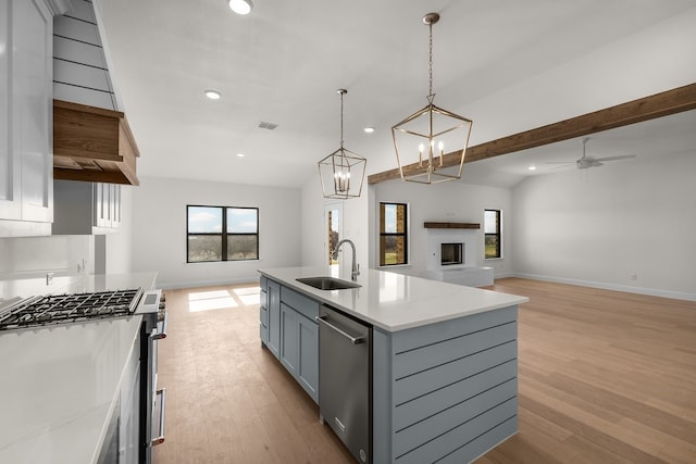 405 Red Roan Rdg, Brock, TX 76087 - kitchen featuring visible vents, gray cabinetry, open floor plan, appliances with stainless steel finishes, and a sink