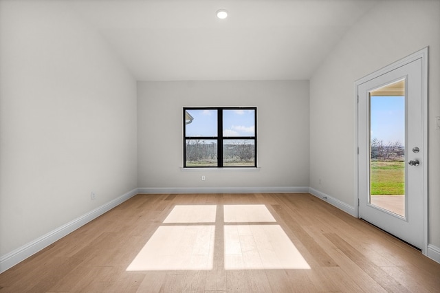 405 Red Roan Rdg, Brock, TX 76087 - empty room featuring plenty of natural light, light wood-style flooring, and baseboards