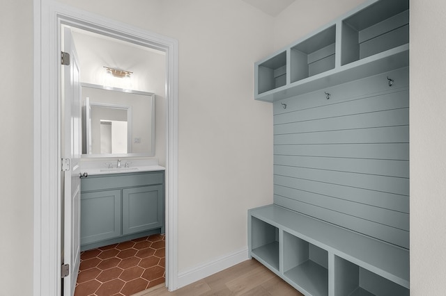 405 Red Roan Rdg, Brock, TX 76087 - mudroom with a sink and baseboards