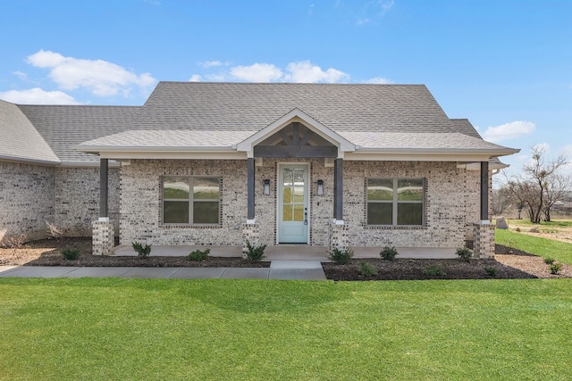 405 Red Roan Rdg, Brock, TX 76087 - view of front of property featuring brick siding, a porch, a front yard, and roof with shingles
