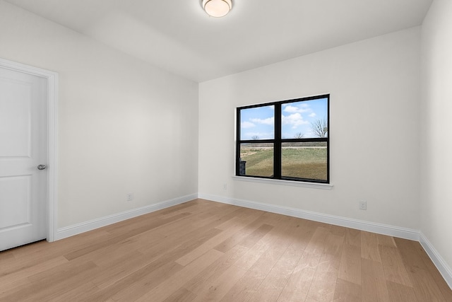 405 Red Roan Rdg, Brock, TX 76087 - empty room featuring baseboards and light wood-style flooring
