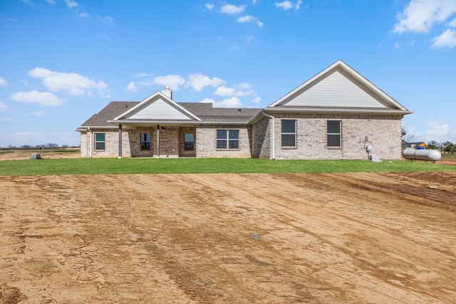 405 Red Roan Rdg, Brock, TX 76087 - view of front of home featuring brick siding and a front lawn
