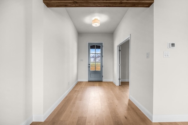405 Red Roan Rdg, Brock, TX 76087 - doorway to outside featuring beam ceiling, baseboards, and light wood finished floors