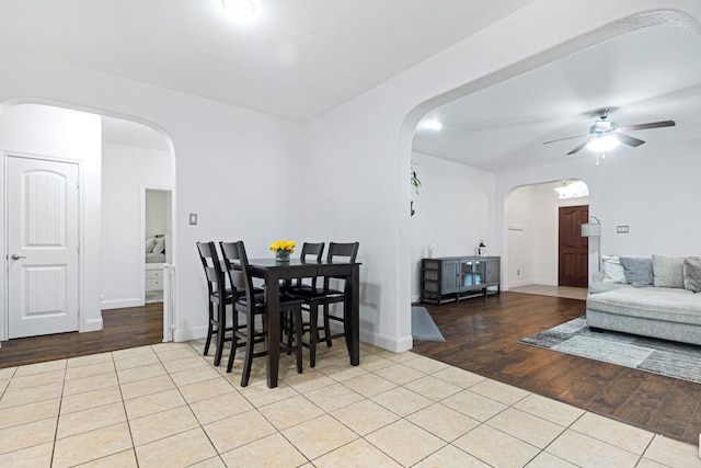 2725 Albatross Ln, Fort Worth, TX 76177 - dining room featuring arched walkways, ceiling fan, and wood finished floors