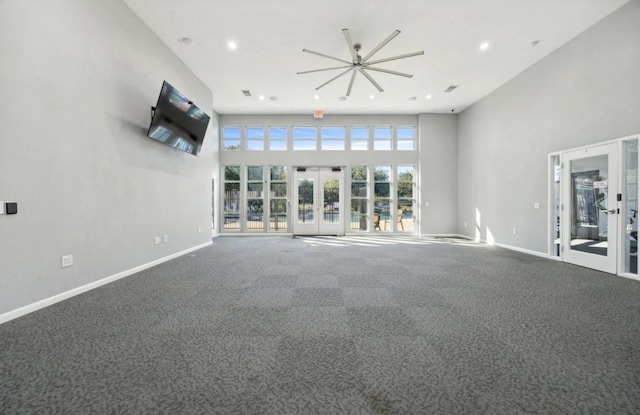 2725 Albatross Ln, Fort Worth, TX 76177 - unfurnished living room featuring ceiling fan, carpet floors, recessed lighting, french doors, and a high ceiling